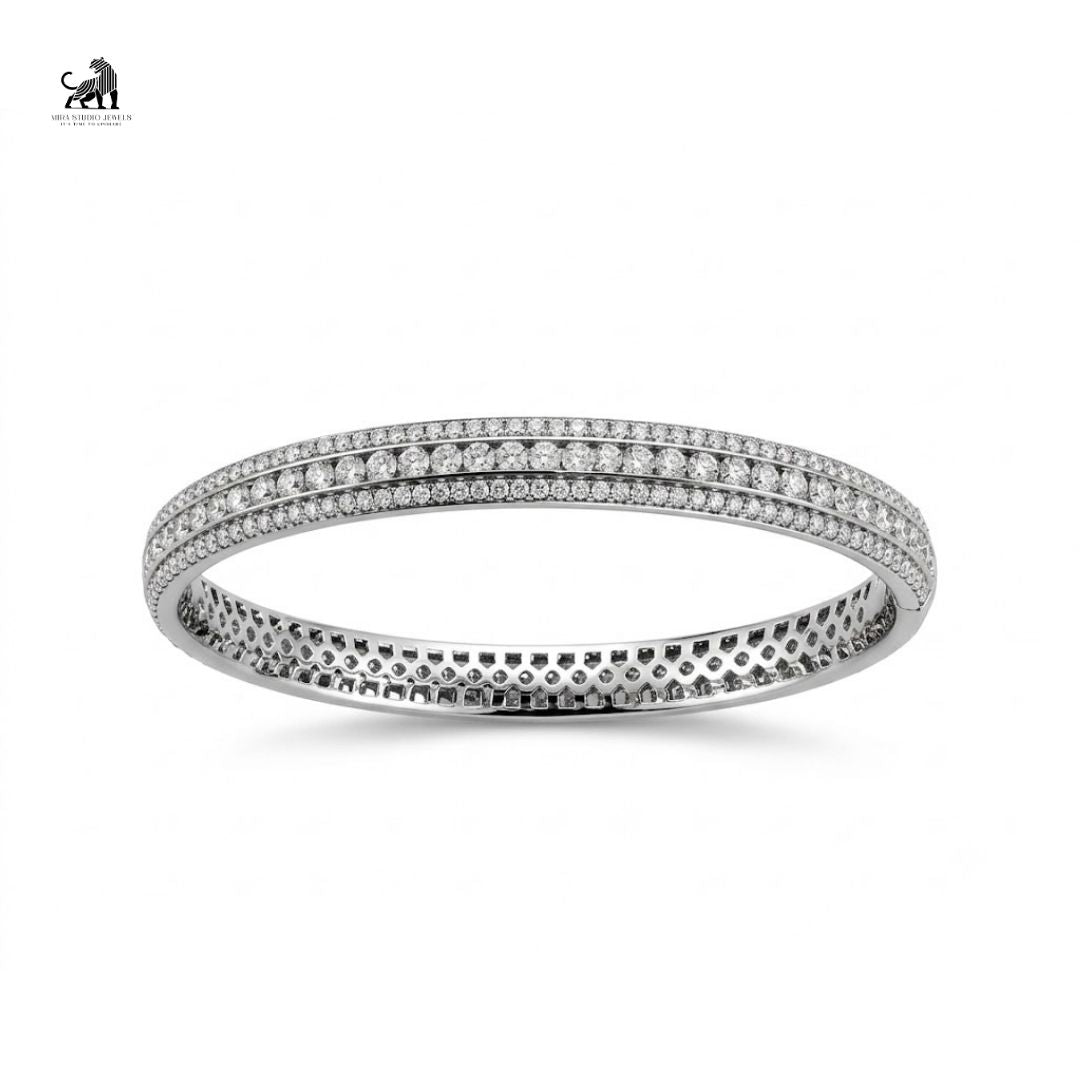 Lab-grown diamond triple-row tennis bangle in white gold on a white background