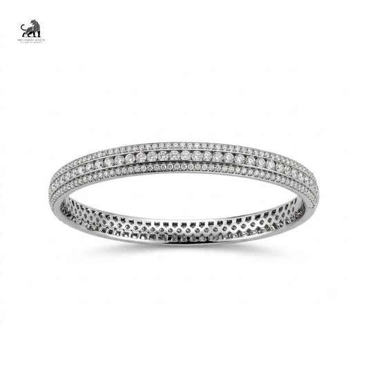 Lab-grown diamond triple-row tennis bangle in white gold on a white background