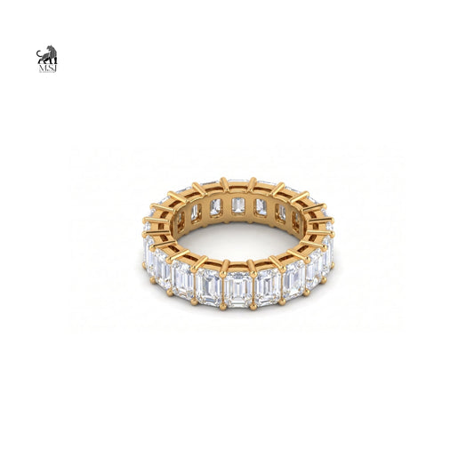 Emerald-cut lab-grown diamond eternity ring in yellow gold on a white background
