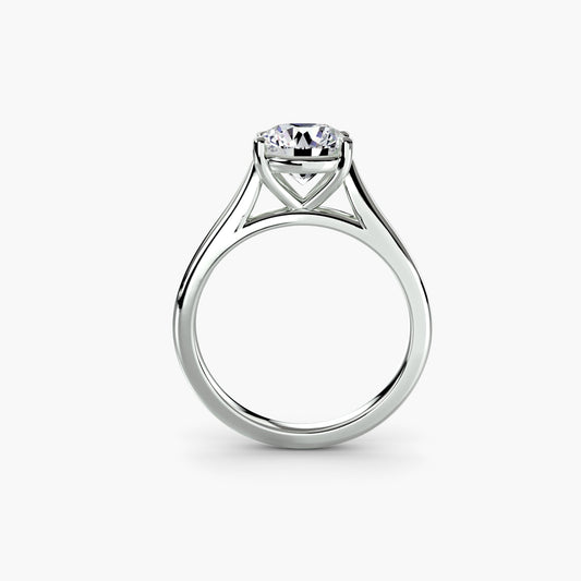 Round lab-grown diamond solitaire ring in a prong setting on a white background