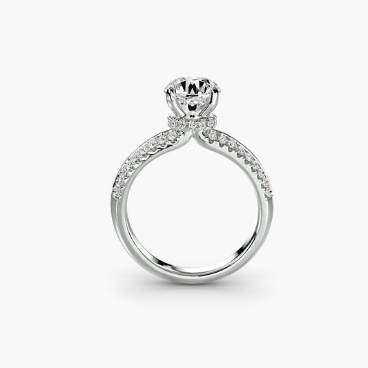 Lab-grown diamond solitaire ring with pavé band on a white background