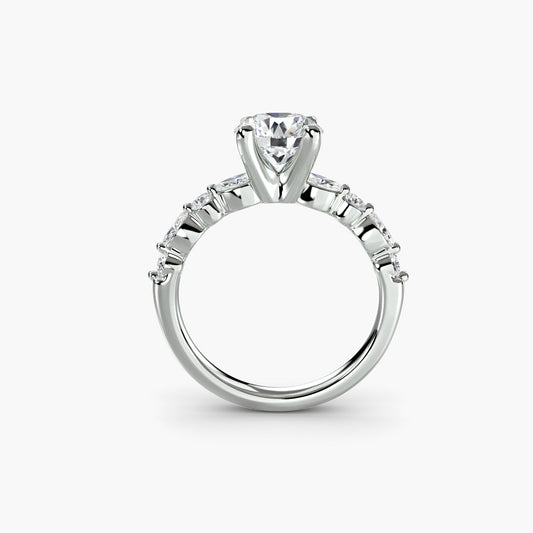 Lab-grown diamond solitaire ring with eternity pavé band on a white background