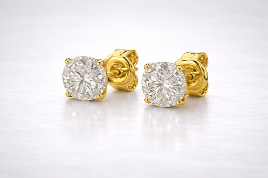 Round brilliant lab-grown diamond stud earring in a yellow gold four-prong setting