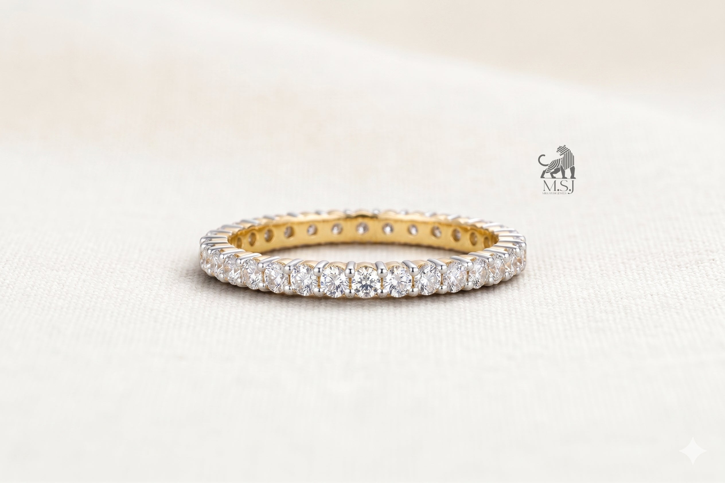 The Lumière Two-Tone Diamond Eternity Ring in yellow gold