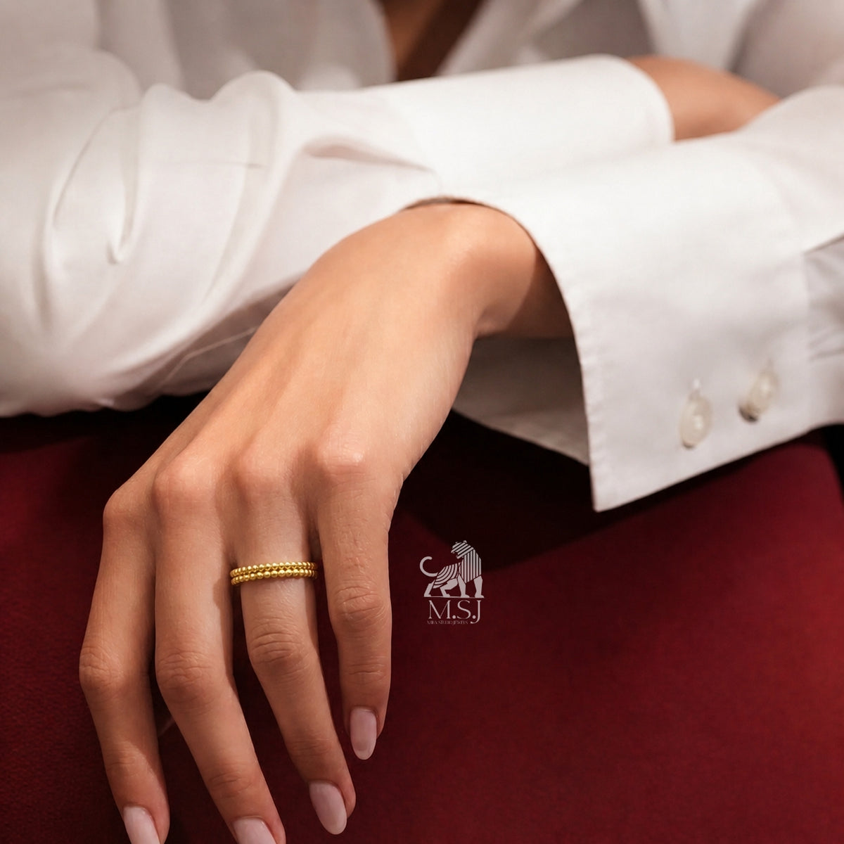 The Solara Beaded Gold Ring worn on a hand