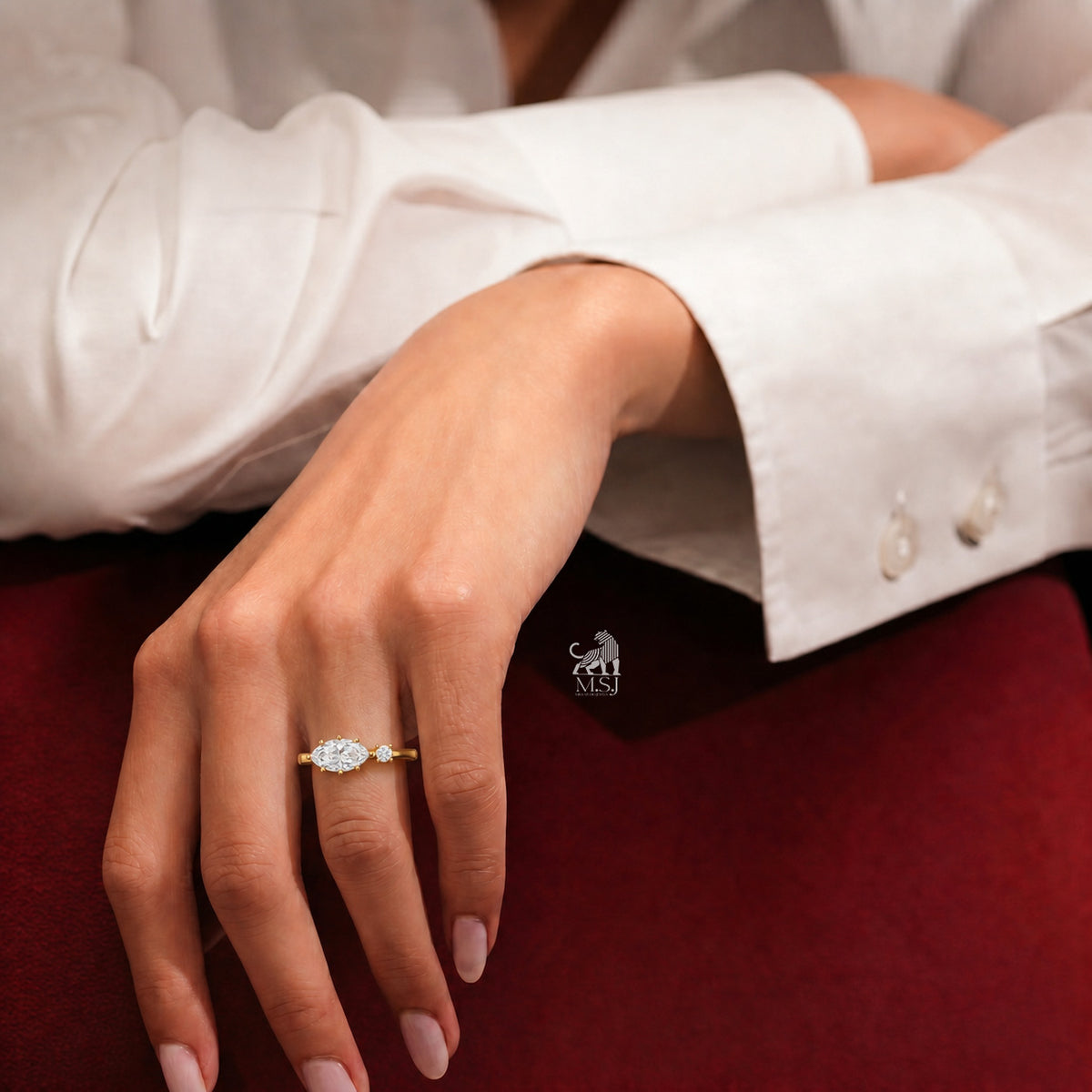 The Marquise Muse Two-Stone Diamond Ring worn on a hand