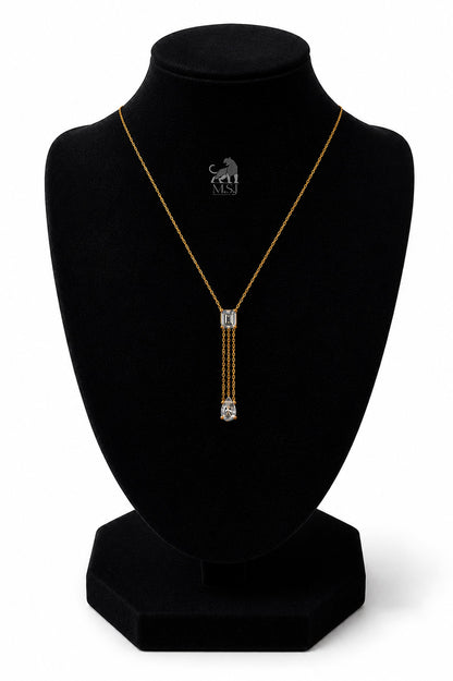 The Elara Emerald & Pear Drop Necklace in yellow gold