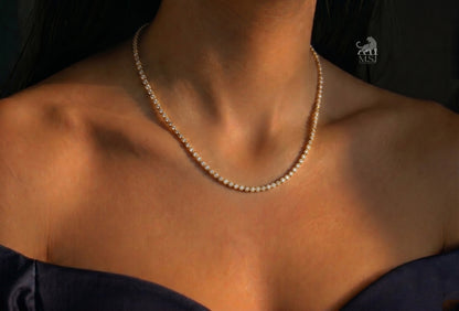 The Étoile Round Diamond Tennis Necklace worn around the neck