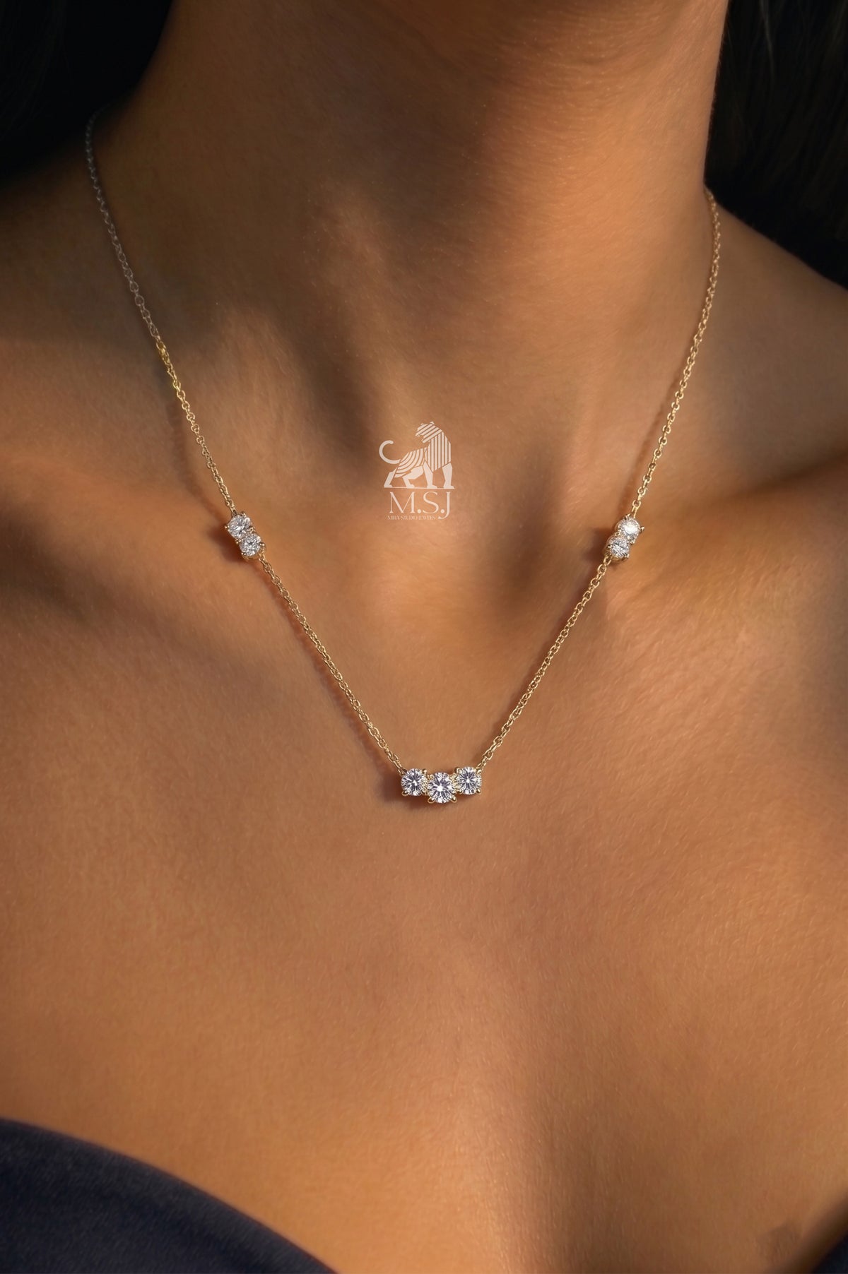 The Amara Diamond Trio Necklace worn around the neck