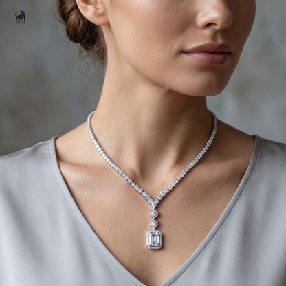 Élan Emerald Drop Diamond Necklace worn around the neck