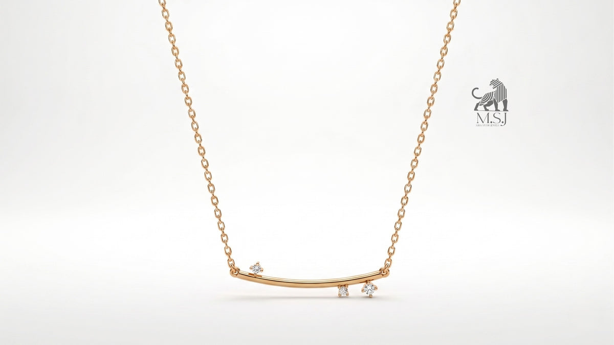 The Celeste Arc Diamond Bar Necklace in yellow gold