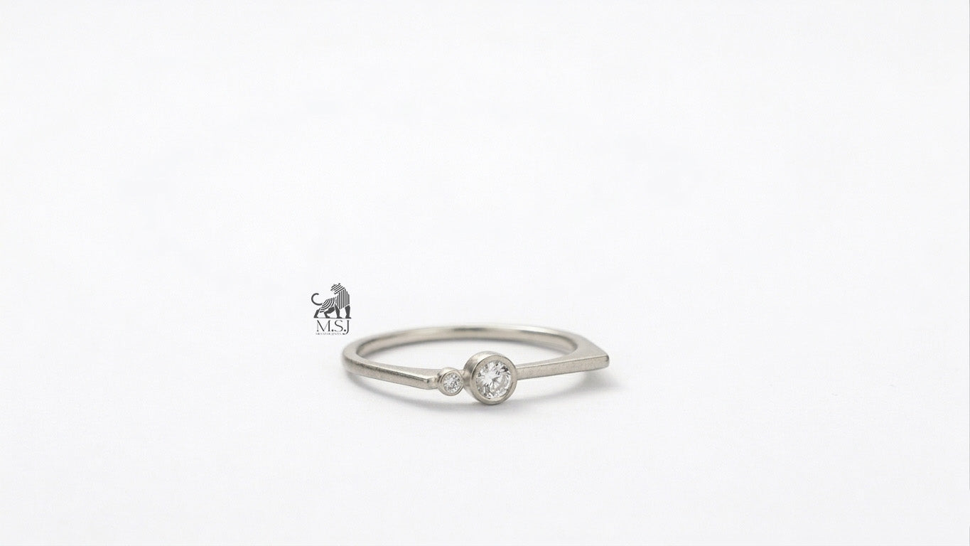 The Solenne Twin Diamond Bezel Ring in white gold