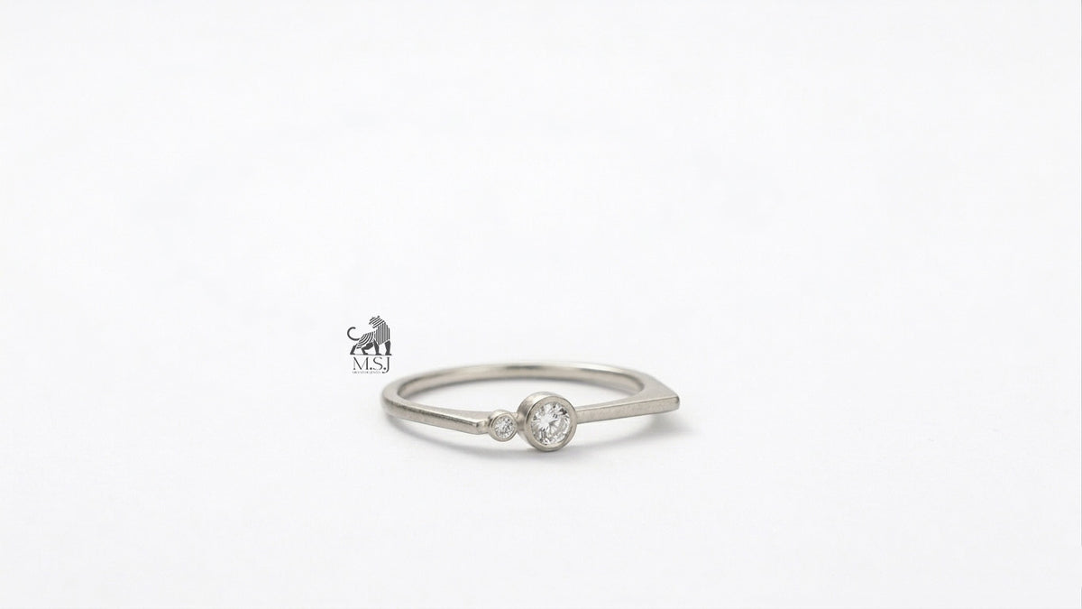 The Solenne Twin Diamond Bezel Ring in white gold