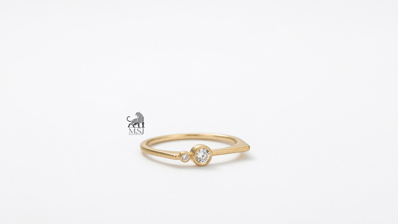 The Solenne Twin Diamond Bezel Ring in yellow gold