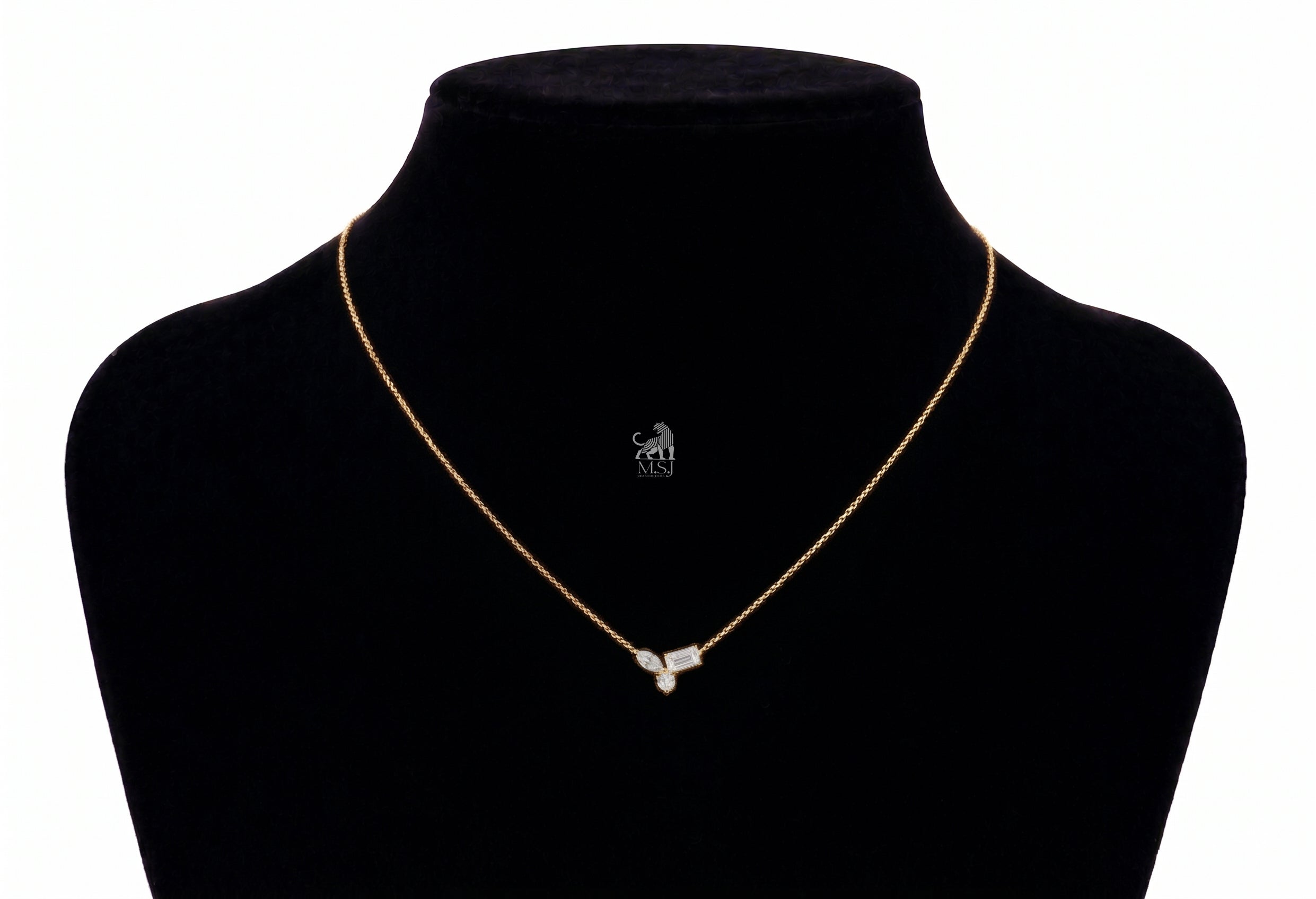 The Elara Three-Stone Diamond Necklace in yellow gold