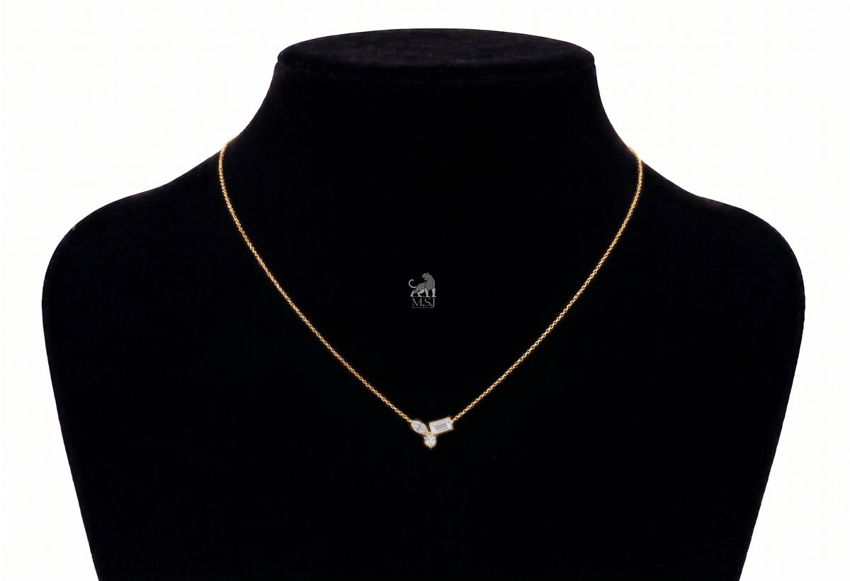 The Elara Three-Stone Diamond Necklace in yellow gold